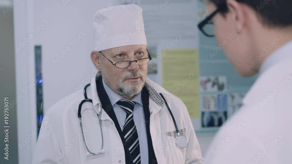 Discussing of two doctors in the hospital. 4K Discussing of two doctors in the hospital. 4K