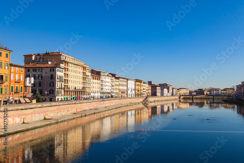 Arno river embankment with colorful old houses in Pisa. Picturesque medieval town of Pisa from bridge Ponte di Mezzo  Pisa  Tuscany  Italy.