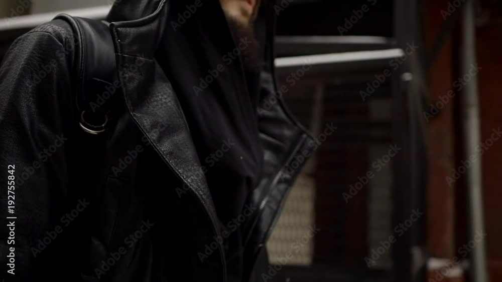mysterious man in a black cloak going on a city trip, flying on the Steadicam close-up from portrait to shoes mysterious man in a black cloak going on a city trip, flying on the Steadicam close-up from portrait to shoes