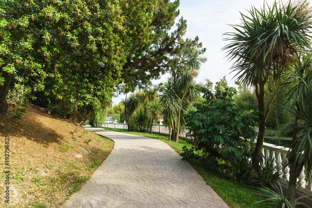 Walking road along the balustrade in the tropical resort city Park