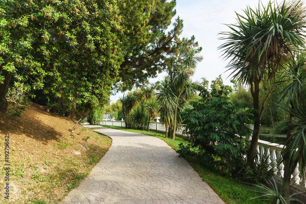 Walking road along the balustrade in the tropical resort city Park Walking road along the balustrade in the tropical resort city Park