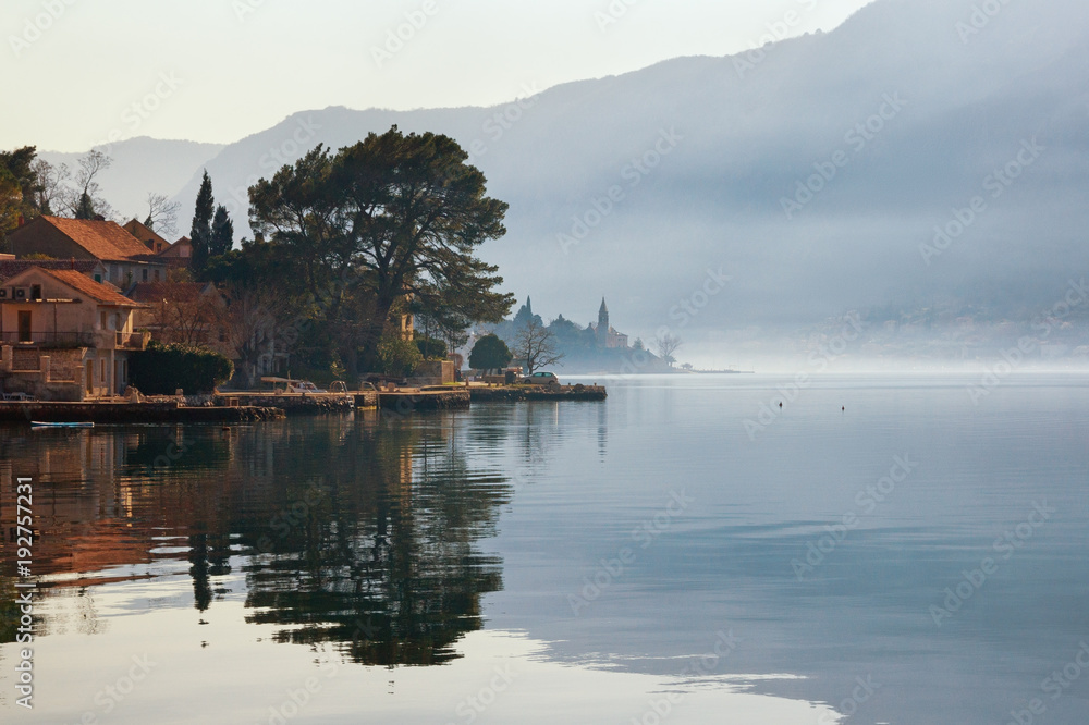 Misty Mediterranean landscape.  Montenegro, winter.  View of Bay of Kotor and Dobrota town