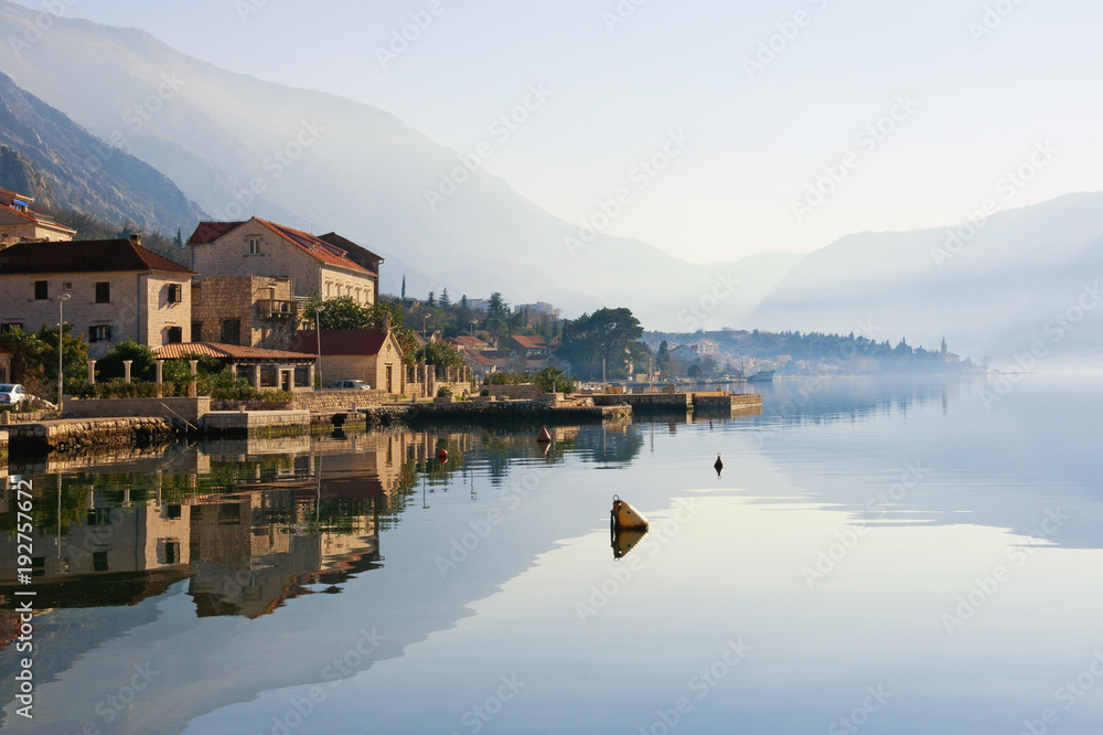 Beautiful Mediterranean landscape on a misty day. Montenegro, winter . View of Bay of Kotor ( Adriatic Sea ) and Dobrota town