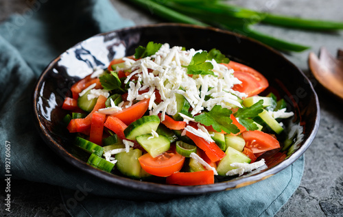 Shopska Salad - Bulgarian salad with tomato, cucumber, pepper, scallion, parsley and cheese