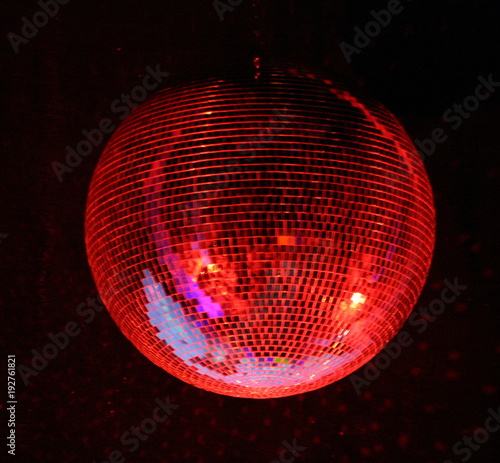 night club lighting red mirror-ball over black