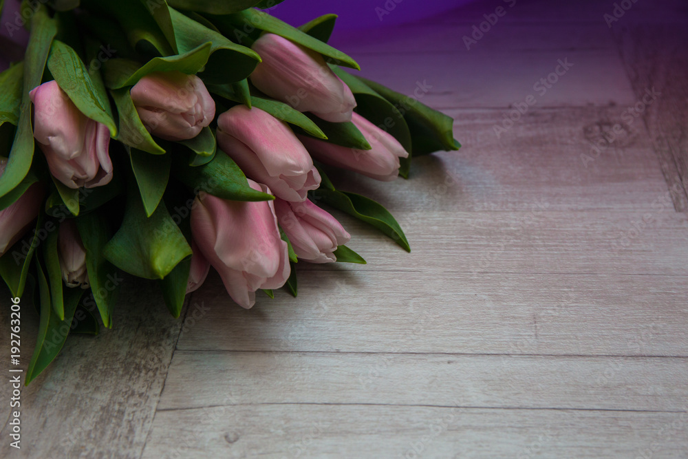 bouquet of tulips on rustic wooden board, easter decoration