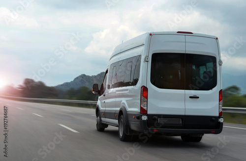 minibus speeding on highway in mountains