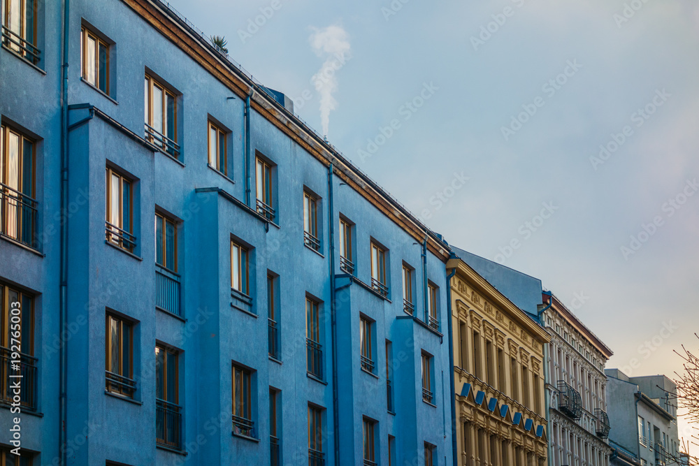 blue and orange buildings with clean sky for copy space