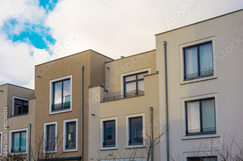 white and brown townhouses in a row © Robert Herhold