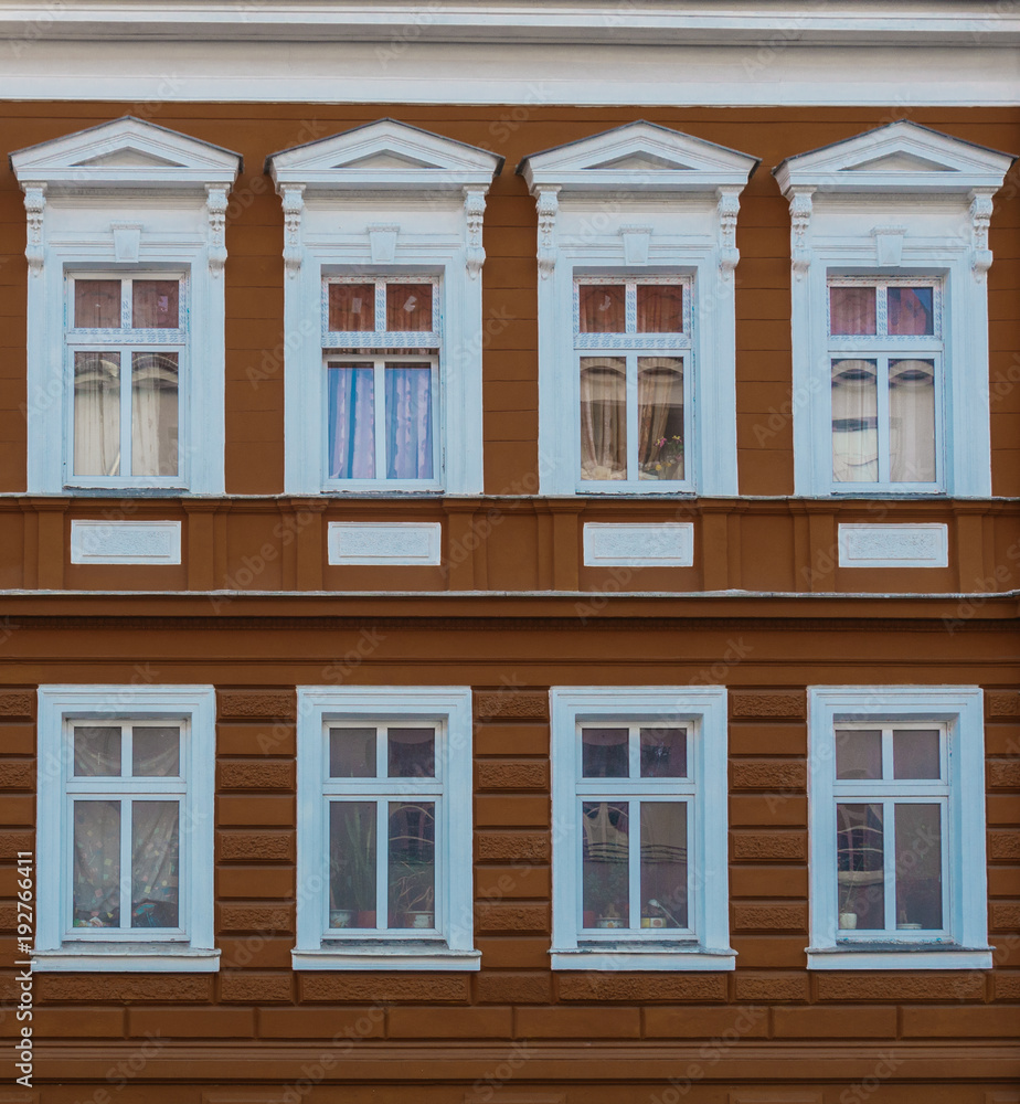 brown facade with white framed windows