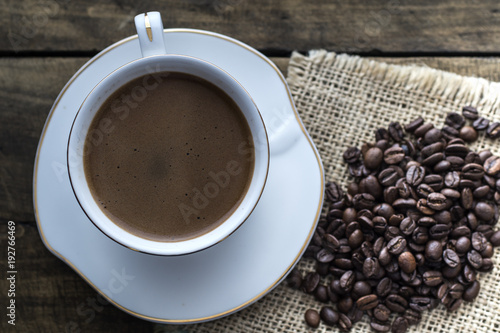 Cup of coffee and coffee beans