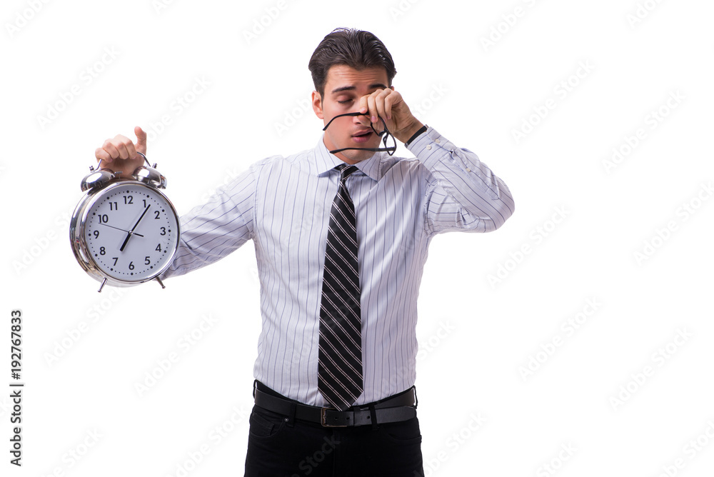 Young businessman in time management concept on white background Young businessman in time management concept on white background