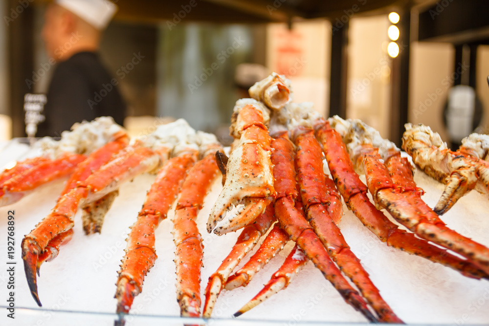 Crab phalanges lie on the ice in the store. Crab phalanges lie on the ice in the store.