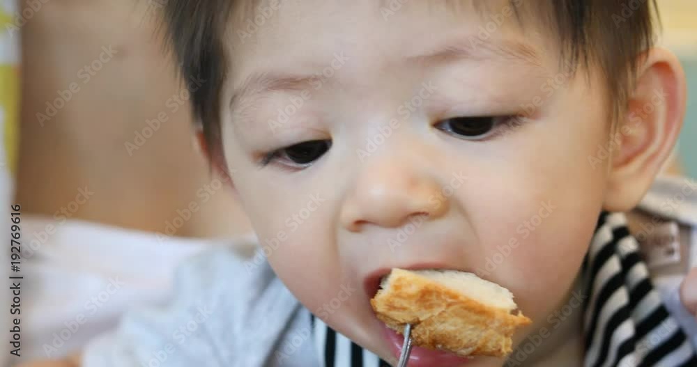 mother play pretend feeding toast with son mother play pretend feeding toast with son