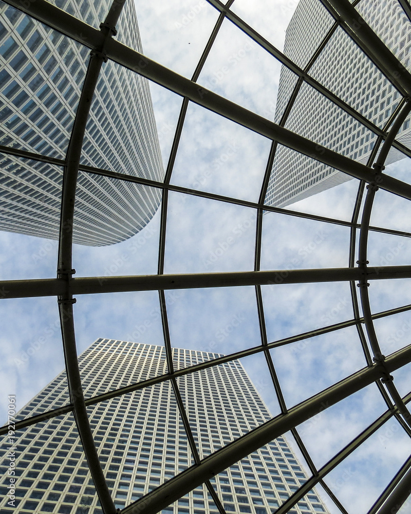 Tel Aviv, Israel - view from below of tall modern skyscrapers from inside a shopping center Tel Aviv, Israel - view from below of tall modern skyscrapers from inside a shopping center