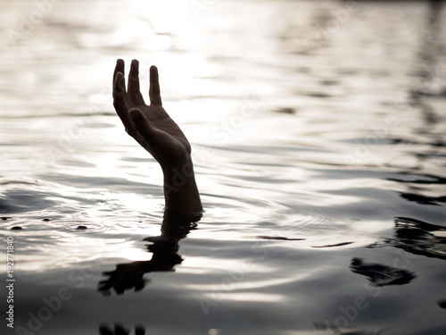 Drowning victims  Hand of drowning man needing help. Failure and rescue concept.