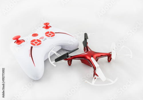 Small red drone with knob and white background