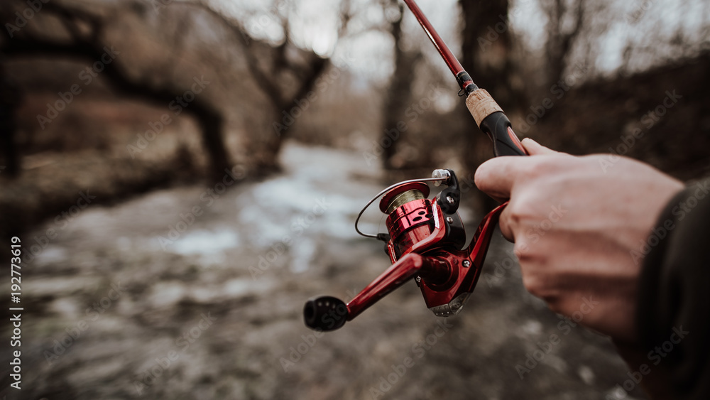 fishing rod detail with stream fishing rod detail with stream