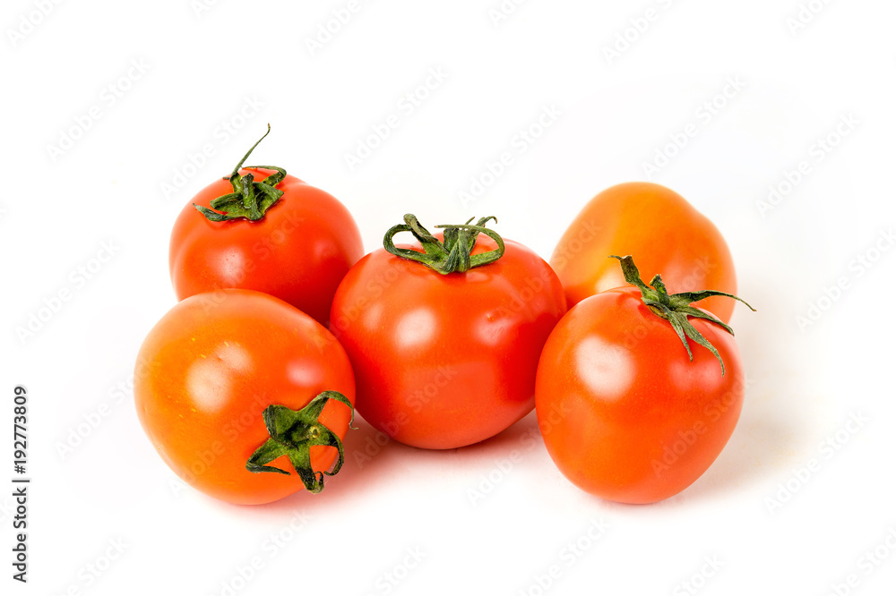 Red organic tomatoes on white isolated background Red organic tomatoes on white isolated background