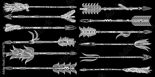 Tribal boho arrow set in ethnical pattern with feathers and bow. Native American Indian style. Hand drawn hipster illustration flesh tattoo black art work design concept. Vector.