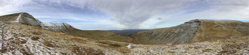 Pen y Fan and Corn Du are the highest mountains in the Brecon Beacons National Park. Panoramic format with winter snow. - obrazy, fototapety, plakaty 