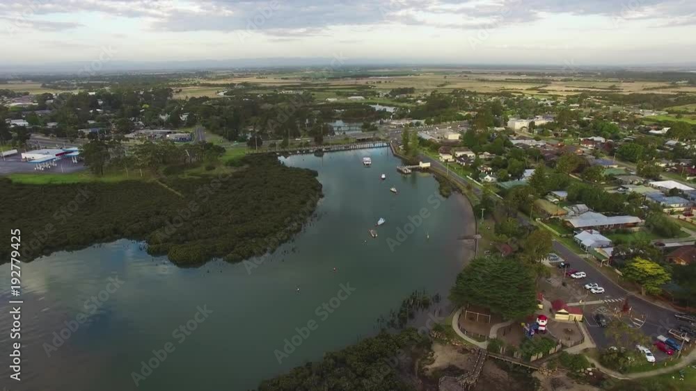 Slow aerial descend over ocean inlet and beautiful coastal town in Australia Slow aerial descend over ocean inlet and beautiful coastal town in Australia