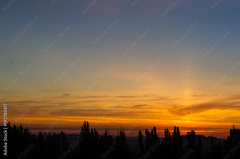 Landscape with dramatic light - beautiful golden sunset with saturated sky and clouds. Landscape with dramatic light - beautiful golden sunset with saturated sky and clouds.