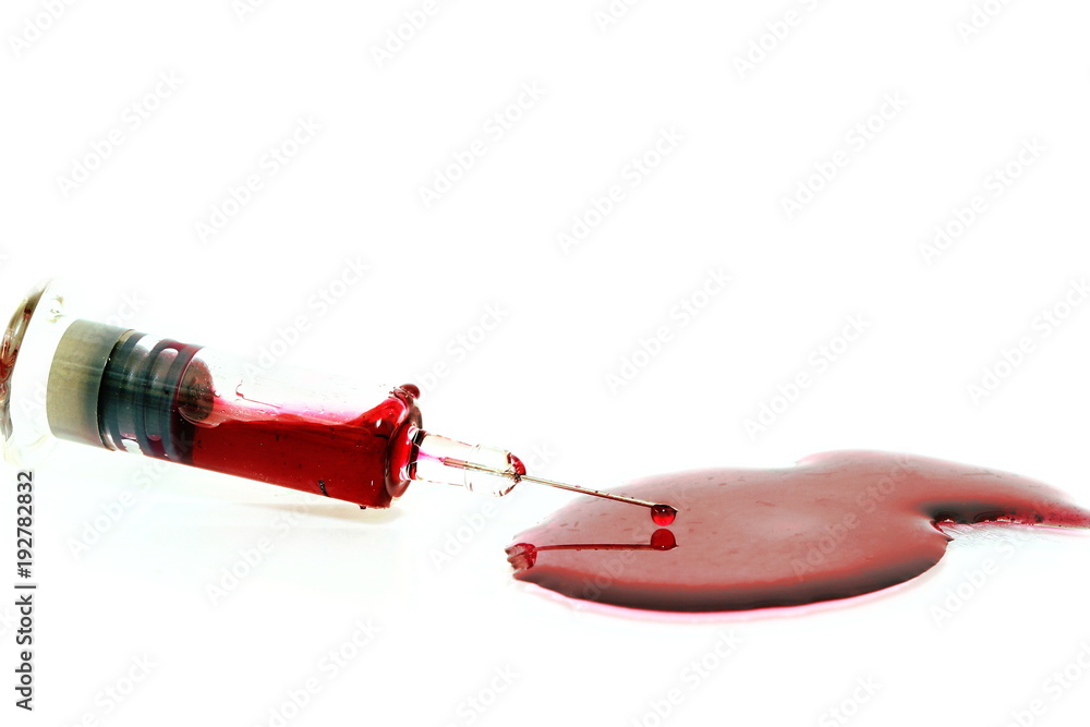 isolated red blood in injection syringe have blood droplet drop at end of needle and have blood on floor on white background isolated red blood in injection syringe have blood droplet drop at end of needle and have blood on floor on white background