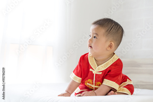 Baby boy wearing red dress for Chinese New Year