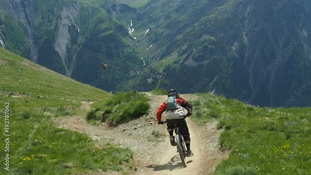Extreme mountain biking in the French Alps during summer season Extreme mountain biking in the French Alps during summer season