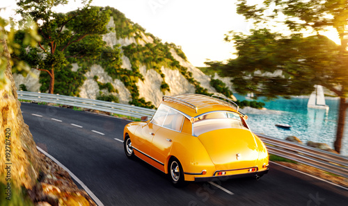 Cute little retro car goes by the road along beautiful harbor between mountai...