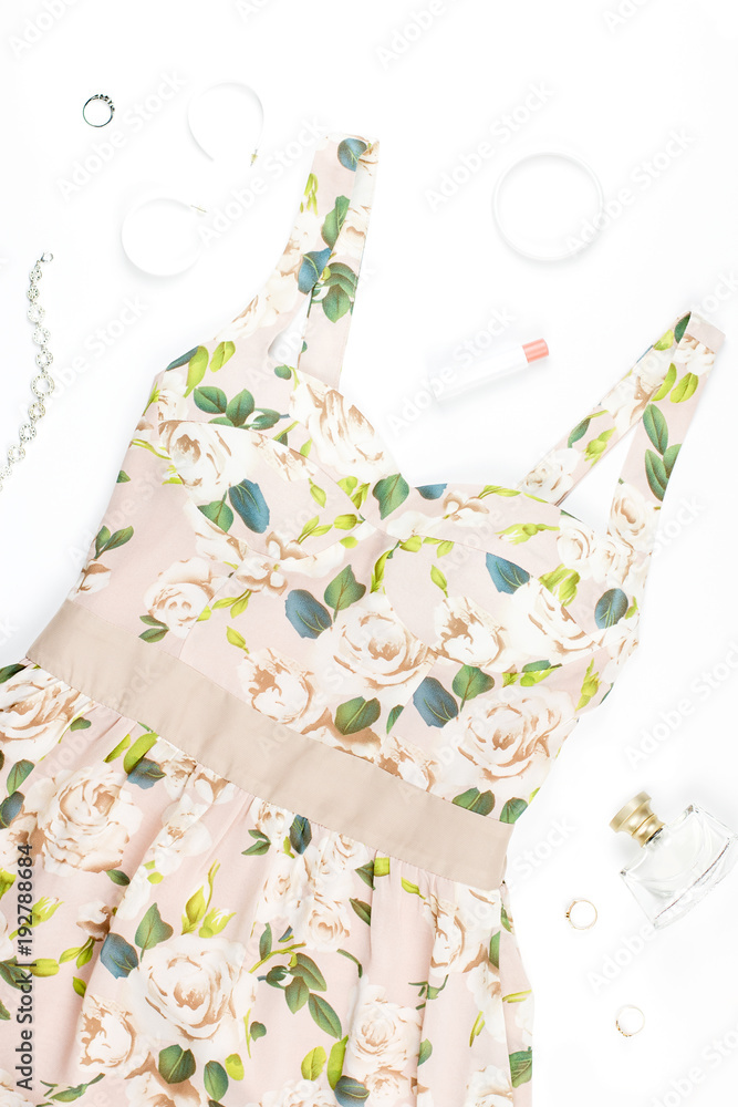 Woman summer dress, accessories and make up items on white background. Summer fashion collection Woman summer dress, accessories and make up items on white background. Summer fashion collection
