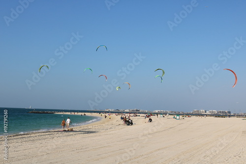 Kite surfing on a beach in Dubai.