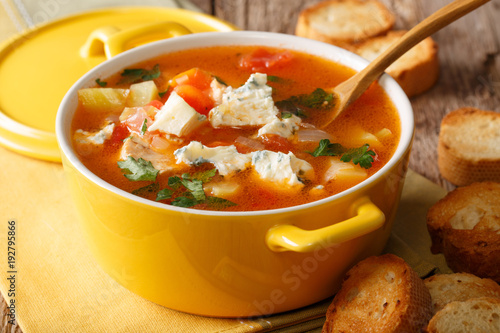 Chicken buffalo soup with vegetables and blue cheese close-up in a saucepan. horizontal