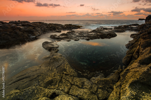Long Exposure sunrise, colorful sky, volcanic rock beautiful seascape at Gran Canaria Island Coast in Spain. © Askanioff