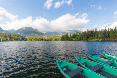 Panorama mountain lake Strbske Pleso in the Tatra mountains. Summers colors and boat for swimming. © Rochu_2008