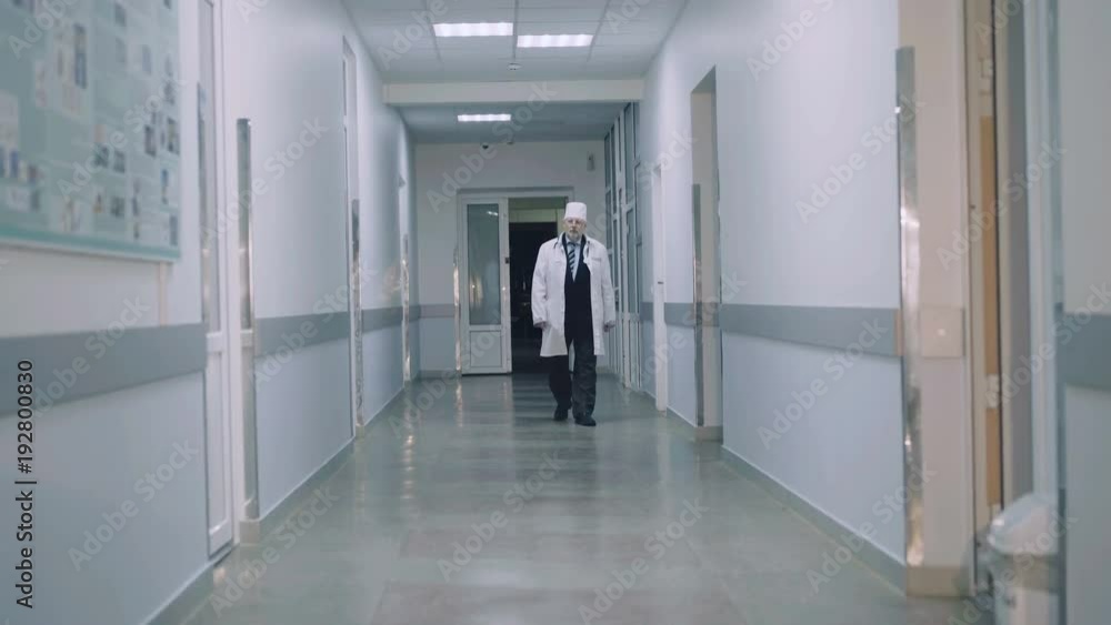 Young intern calls senior doctor for help in hospital's corridor. 4K Young intern calls senior doctor for help in hospital's corridor. 4K