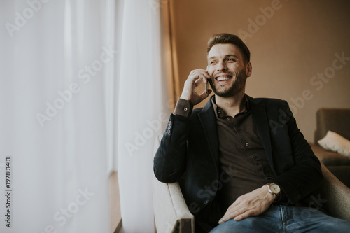Young man with mobile phone...