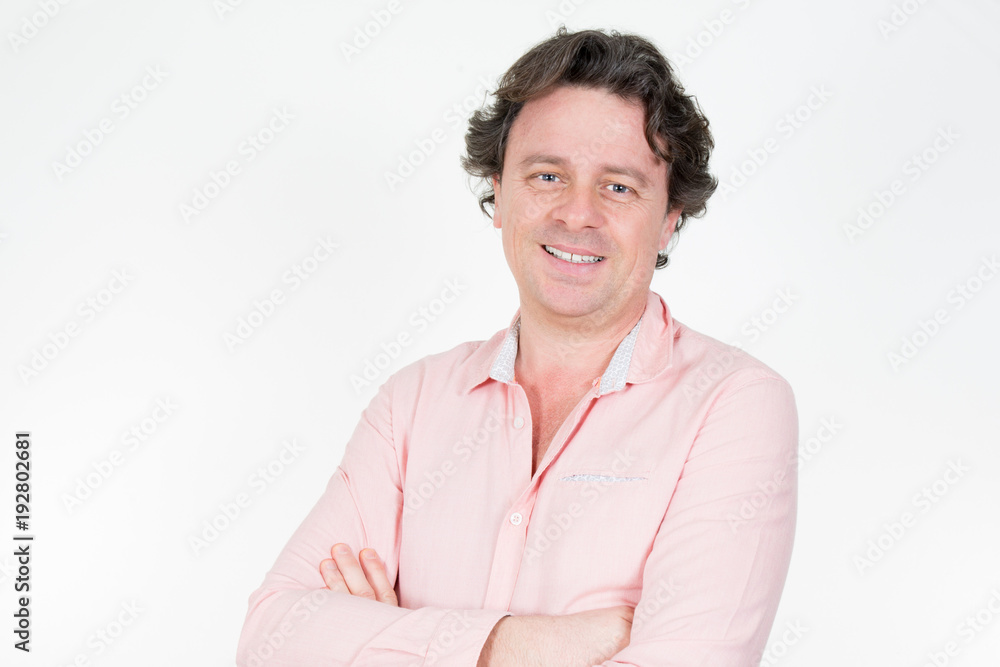Close up portrait of laughing casual man standing with arms crossed Close up portrait of laughing casual man standing with arms crossed