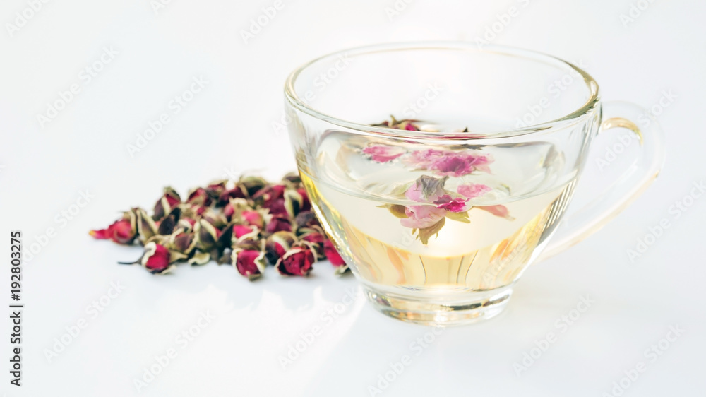 A cup of tea pink rose on a white background. A cup of tea pink rose on a white background.