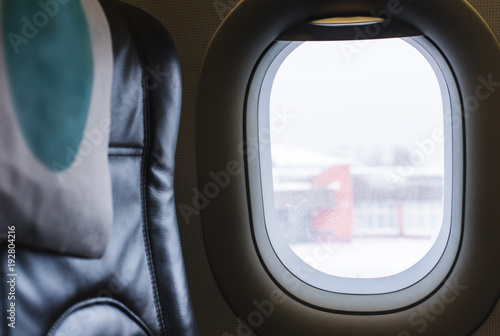 Air plane widow with empty seat. Travel and journey by plane concept