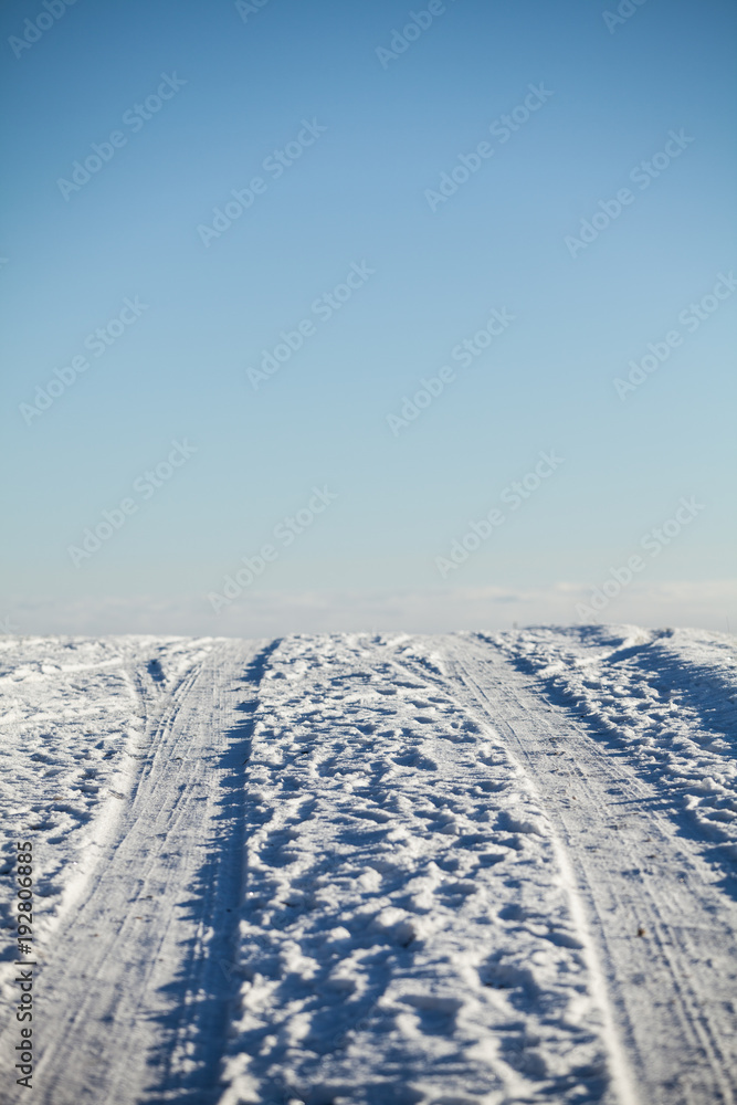 Car trails in wintry backcountry