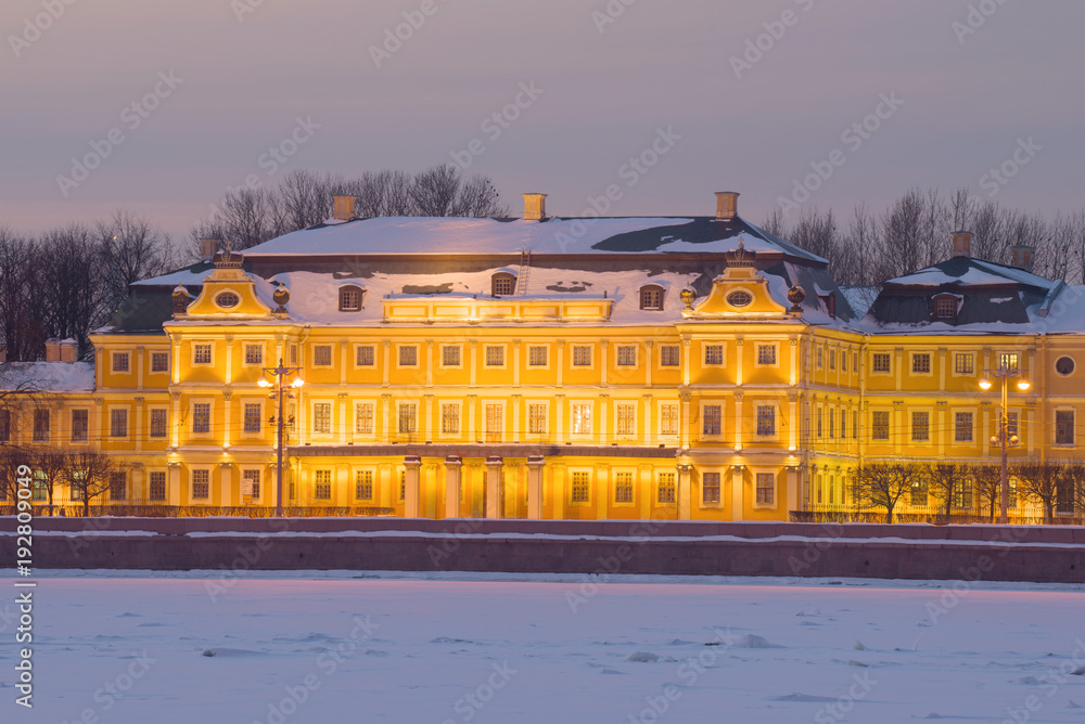 Fragment of the facade of the Menshikov Palace in the night illumination. Winter twilight in St. Petersburg, Russia