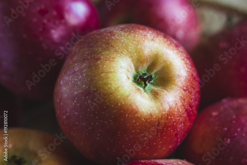 Delicious juicy apples. in a wooden basket. On a wooden table!
On a black background.