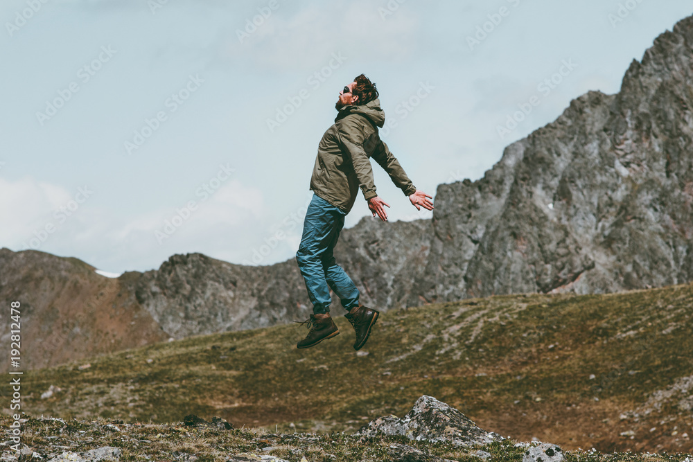 Travel Man jumping levitation outdoor on mountains lifestyle spiritual concept Travel Man jumping levitation outdoor on mountains lifestyle spiritual concept