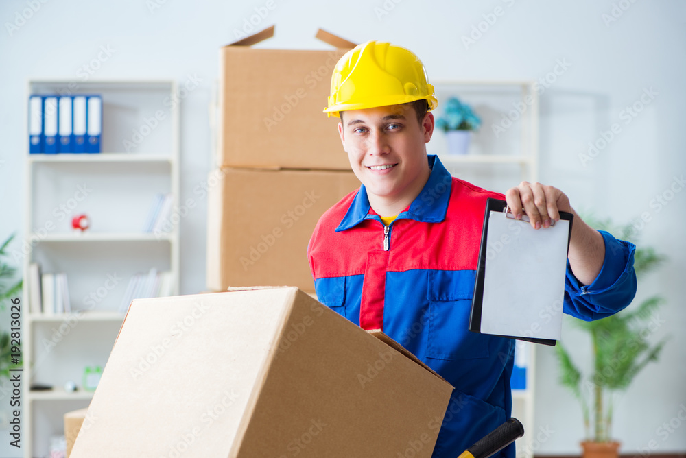 Young man working in relocation services with boxes Young man working in relocation services with boxes