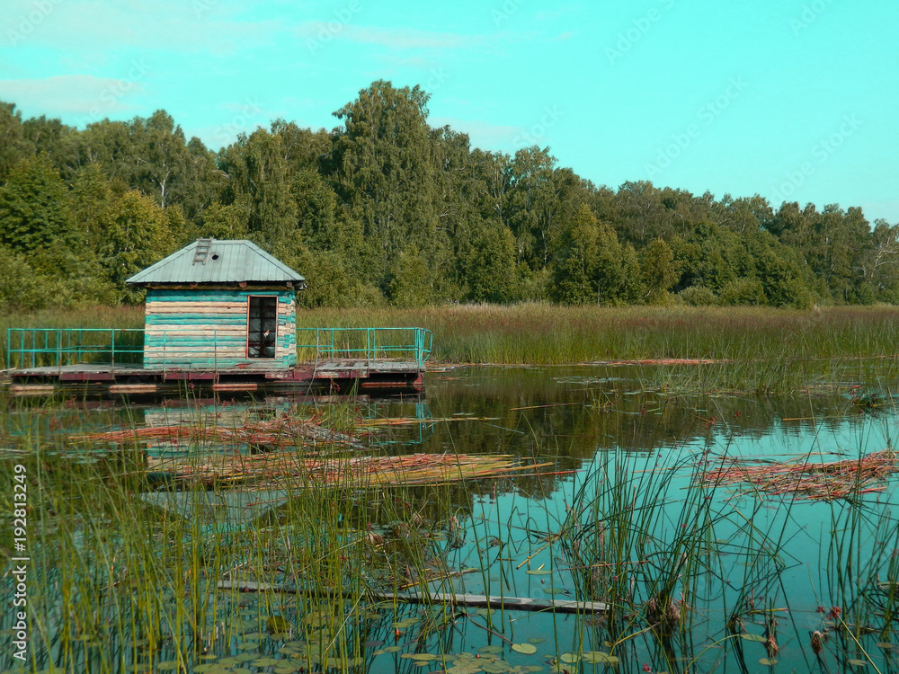 Abandoned fishing hut on the lake Abandoned fishing hut on the lake