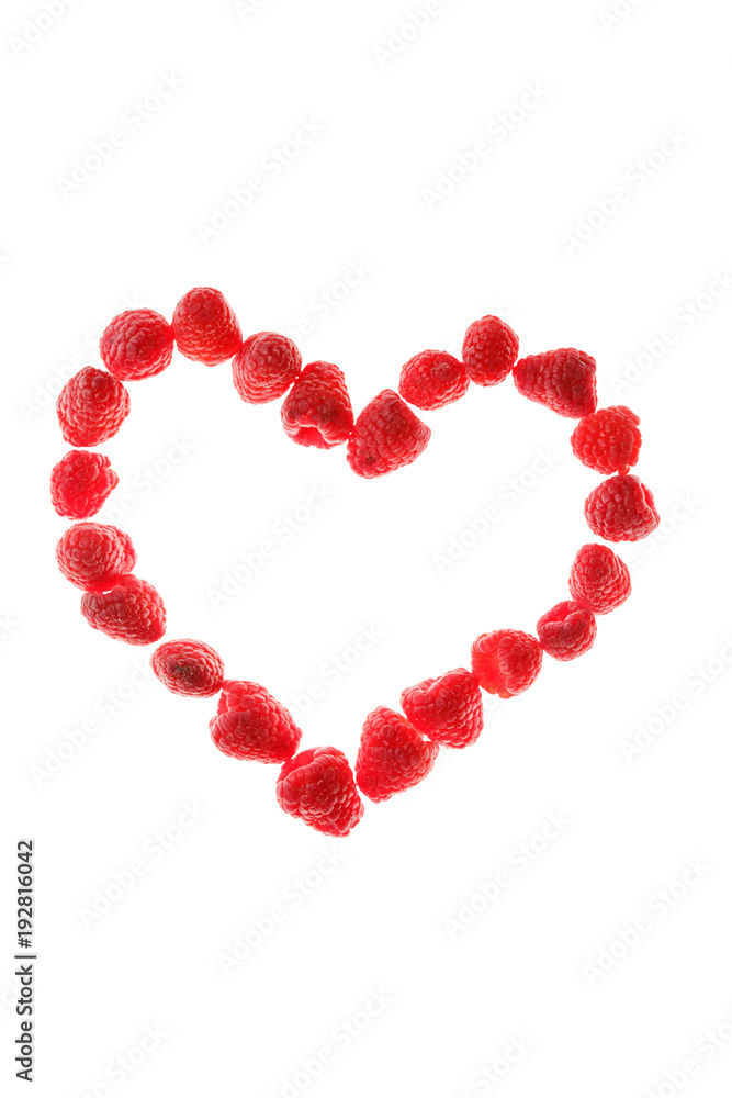 Fresh raspberries lined in the shape of the heart. Fresh raspberries lined in the shape of the heart.