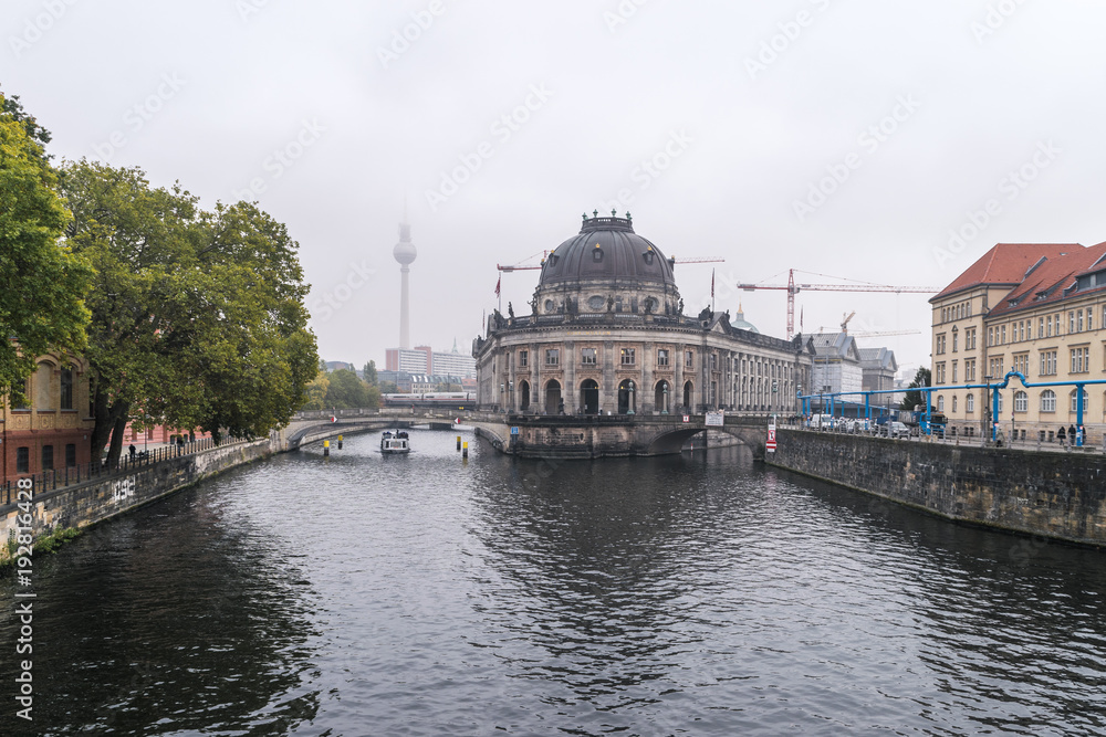 A front view of Bode museum and the river Spree in autumnal Berlin