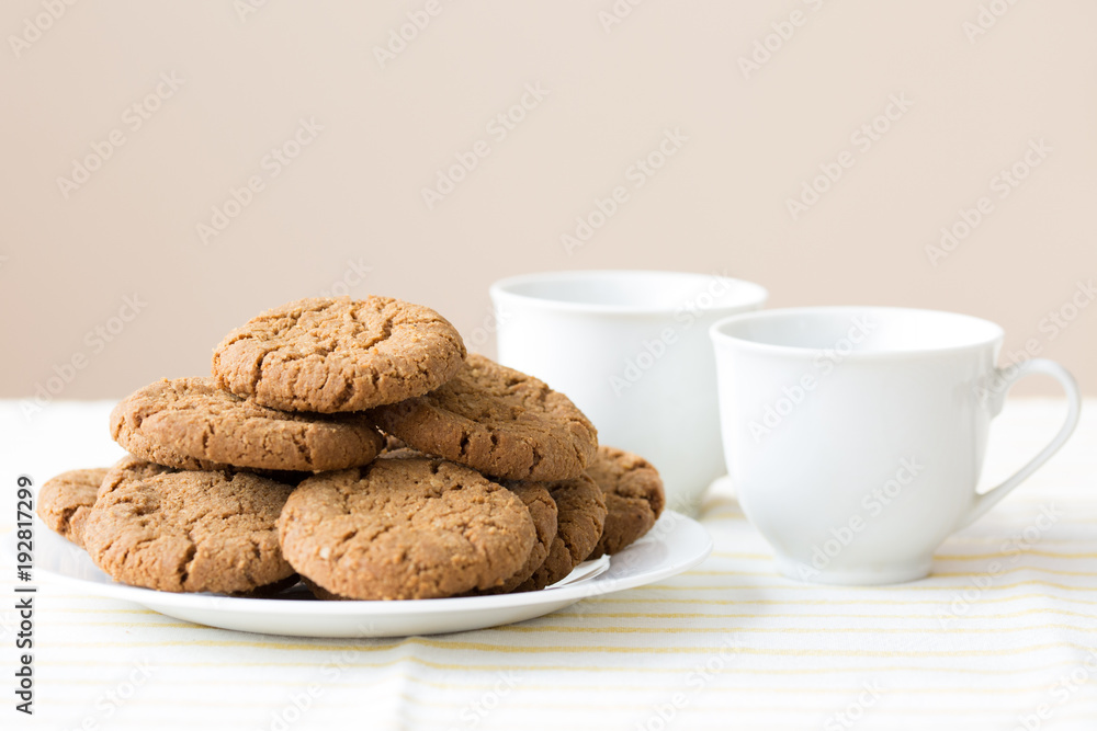 Healthy breakfast with oatmeal cookies or oatcakes and cup of tea or coffee Healthy breakfast with oatmeal cookies or oatcakes and cup of tea or coffee